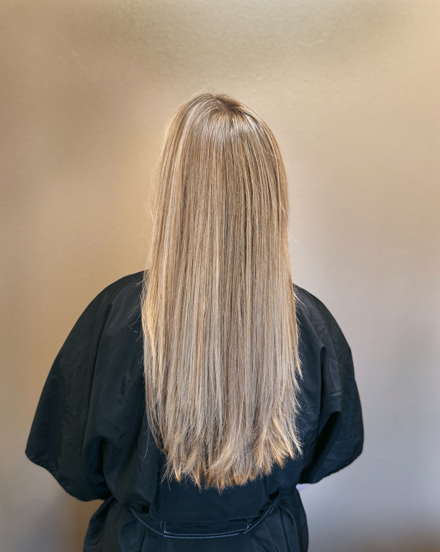 Long natural blonde dimensional highlights with seamless grow-out
